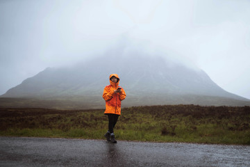 Orange raincoat in the rain