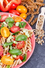 Fresh salad with wholegrain pasta and vegetables. Healthy lifestyles and nutrition