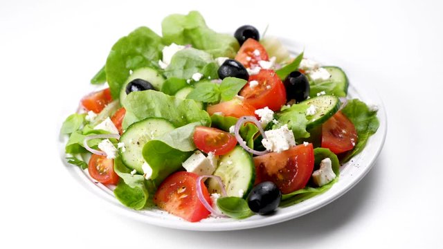 greek salad with tomato, olive, cucumber, onion and feta cheese