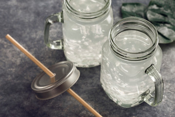 Coconut water in glass jar with copy space