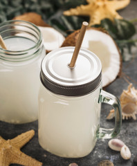 Coconut milk drink in glass jar with handle