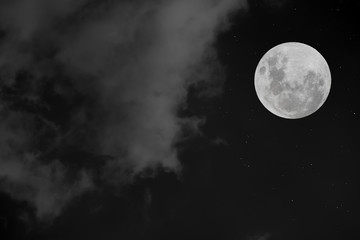 Naklejka na ściany i meble Full moon with white cloud in the dark night.
