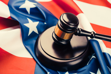 Judge gavel on the background of the flag united states of America