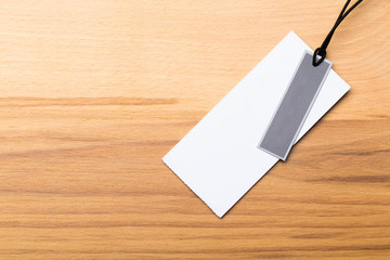 Blank tag, label blank mockup template on a wooden background