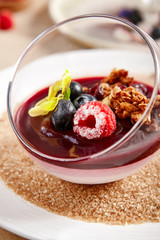 Berry Panna Cotta with Currant-Cointreau jelly in glass bowl