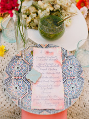 A place setting for a dinner guest at a colorfully decorated table