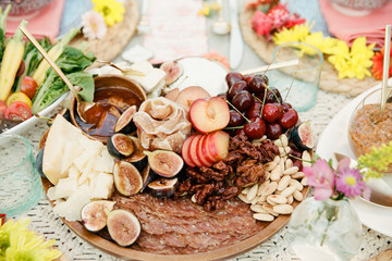 A close up of a charcuterie plate set up outside for an al fresco feast