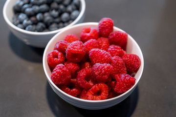 Fresh blueberries and raspberries in bowl