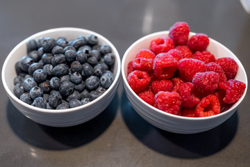 Fresh blueberries and raspberries in bowl