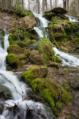 City Cesis, Latvia. Old waterfall with green moss and dolomite rocks.