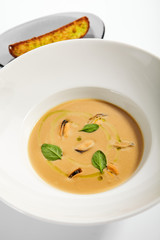 Chilean mussels soup in white bowl
