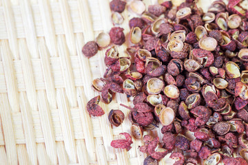 Sichuan red peppercorn close-up in bamboo basket background