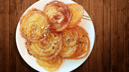 Home Made Jalebi - An Indian Sweet on Wooden Table