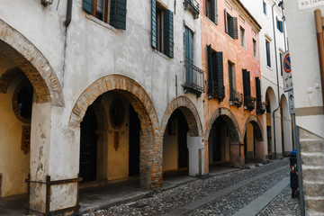 Fototapeta na wymiar Ancient streets with arches in the walls of houses made of wild stone | VENICE, ITALY - 16 SEPTEMBER 2018. 