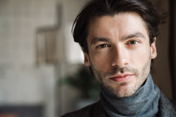 Close up of a handsome young bearded man