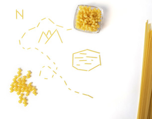 pasta treasure map with spaghetti and macaroni in bowl on white background