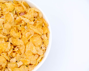 Obraz na płótnie Canvas cereal in a white bowl on white background. Healthy breakfast concept.