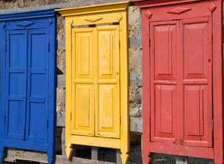 Bright colorful wooden doors made like a fence
