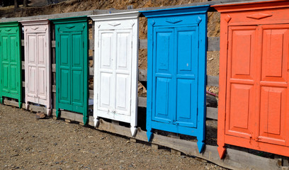 Fototapeta na wymiar Bright colorful wooden doors made like a fence