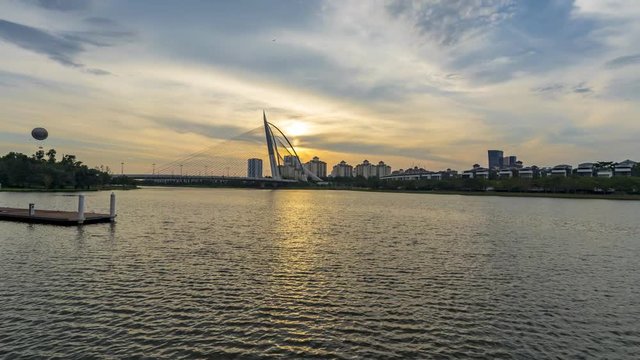 Beautiful sunrise by the lakeside in Putrajaya, Malaysia. Motion time lapse.