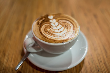 Coffee drink in a white cup. Flat white or cappuccino