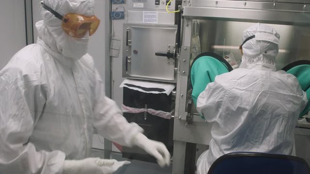 MED two lab techs Vaccine lab testing setup