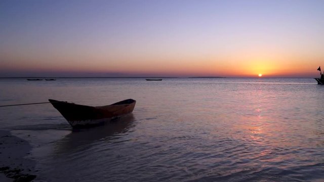 Fire red sunset type from Kendwa beach in Zanzibar Tanzania. Typical Zanzibar boat.