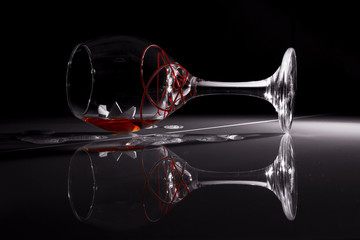 Fototapeta na wymiar red wine glass on black