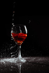 red wine splash in glass