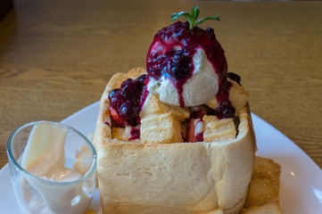 Sweet Brioche bread with berry jam and ice cream