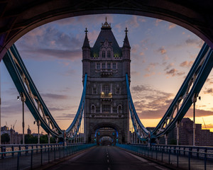 view on road through Tower Bridge from double decker Big Bus tour boat, second floor, people, suspension rods, tower. © othman