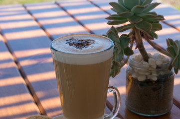 Coffee drink in a tall glass Flat white or cappuccino