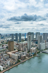 Obraz premium Aerial drone view of Tokyo cityscape with skyscrapers business offices