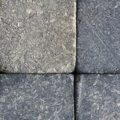 Stone background close-up. Natural texture. Gray backdrop or wallpaper. Rough surface. Soapstone whiskey rocks. Reduced contrast. Square shot. Macro