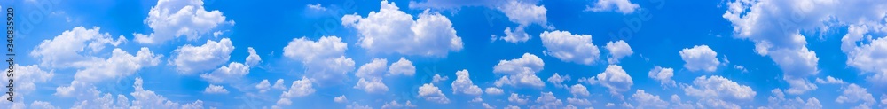 Wall mural panorama blue sky background with tiny clouds.