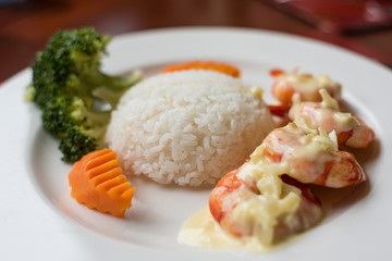 Rice with vegetables and curry meal. White steamed rice served with spicy curry