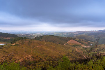 Fototapeta na wymiar Mountain landscape with dry grass and rainy storm clouds