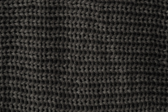 Black knitted fabric background