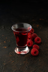 rich alcoholic raspberry tincture in a glass