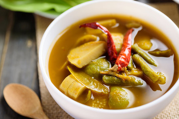 Southern Thai food (Kaeng Tai Pla ), fish organs sour soup in a bowl with spoon ready to eating
