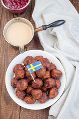 Meatballs served with cream sauce and cranberry jam, swedish cuisine, vertical,  top view
