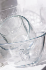 a set of glassware on the windowsill and reflection in bright sunlight