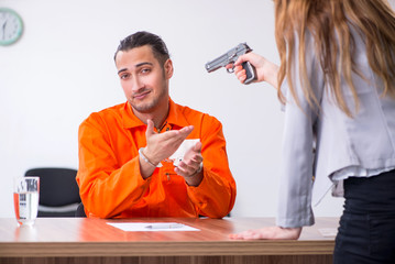 Young man meeting with advocate in pre-trial detention