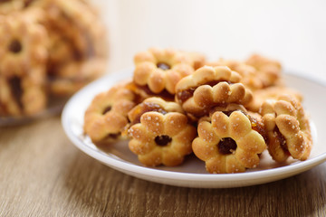 Cracker with pineapple jam (flower shape) on plate ready to eating, Thai snack