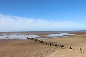 Old wooden groynes on the beach at Hunstanton Norfolk UK