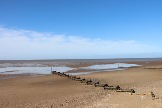 Old wooden groynes on the beach at Hunstanton Norfolk UK