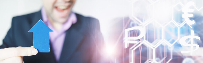 Financial crisis. Concept. Money bills in hand. Arrow symbol of the fall of the national currency. The change in the exchange rate between the Russian ruble and the US dollar.