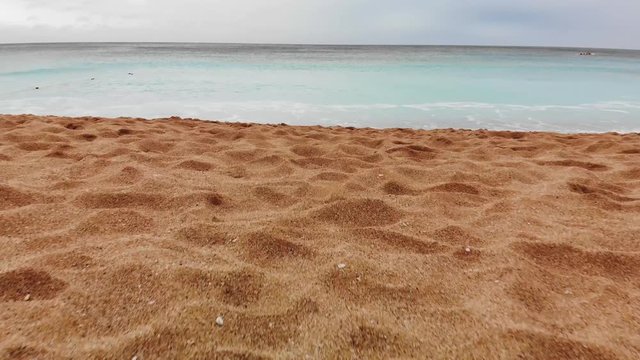 Kenting Baishawan beach turquoise water waves crashing on the beautiful sand, White Sand Bay, Hengchun Peninsula of Pingtung County, Taiwan. Drone dolly 4K shot.