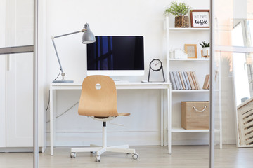 Background image of empty office workplace behind glass wall in modern minimal design, copy space