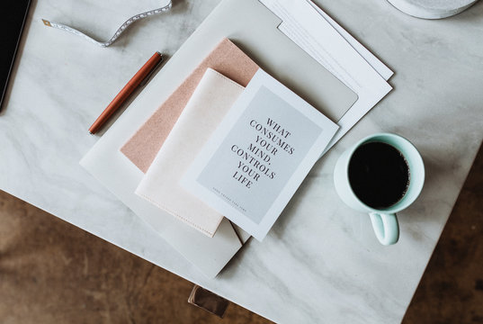 Stack of books and a coffee